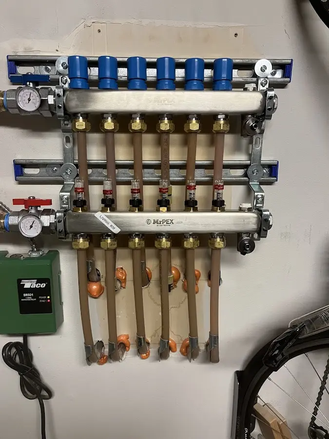 Plumber performing Water Heater Repair at a residential property in Green Lake